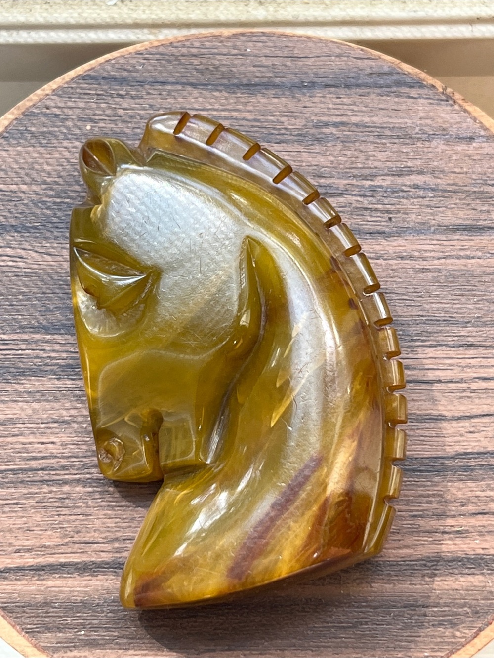 Vintage bakelite horse head brooch olive green swirl color
